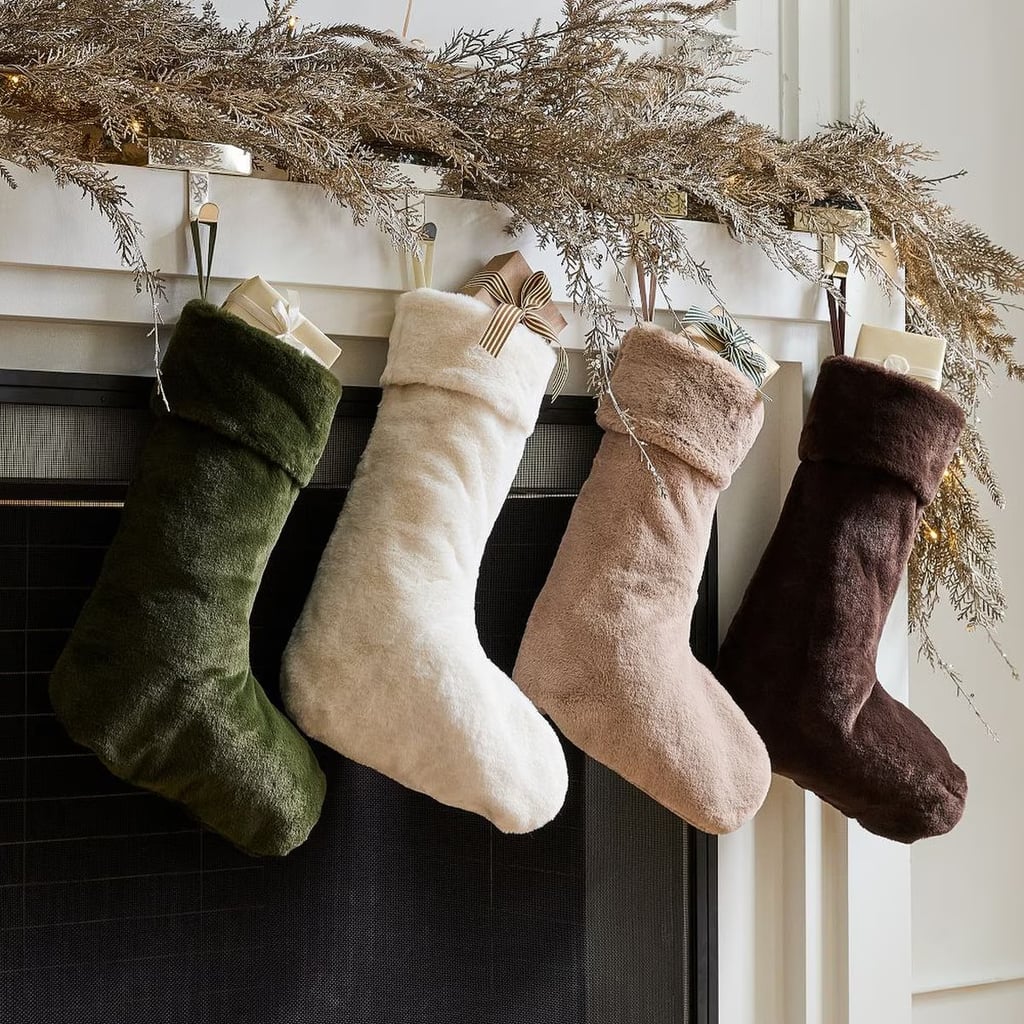 West Elm Plush Fur Stockings ($21, originally $35)
These stockings are pure holiday coziness. The fluffy texture and neutral shade make them actually look chic on your mantel. Honestly, grabbing them at $21 is basically a no-brainer.