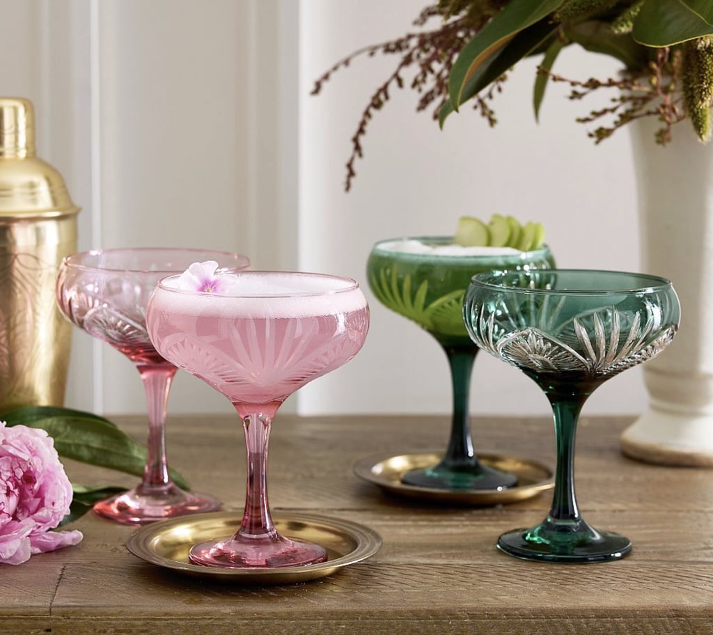 Wicked Coupe Glasses (Set of 4) ($99)
Whether you're hosting a movie pre-game or just inviting friends over to catch up, you'll want to pull out this pink and green-themed glasses set for homemade cocktails. Made from soda lime glass and featuring hand-carved designs, it'll be sure to garner plenty of compliments.