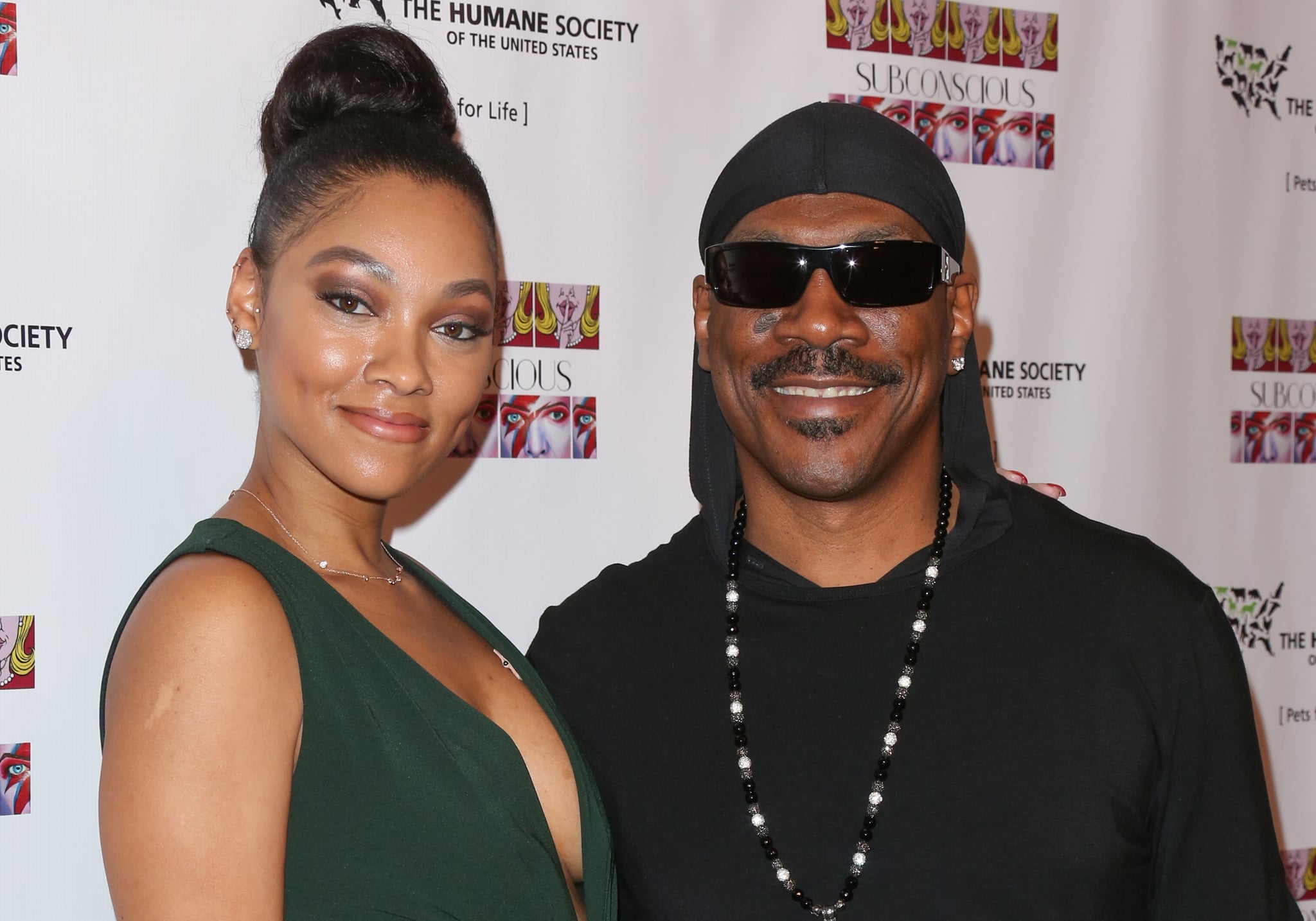 LOS ANGELES, CA - NOVEMBER 20:  Artist / Actress Bria Murphy (L) and Actor Eddie Murphy (R) attend the debut gallery opening of Bria Murphy's 