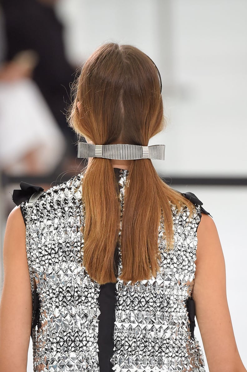 From clips and scarves to combs and leather tails, the spring 2015 runway hair  accessories that are adding embellishment to the season's simple styles.