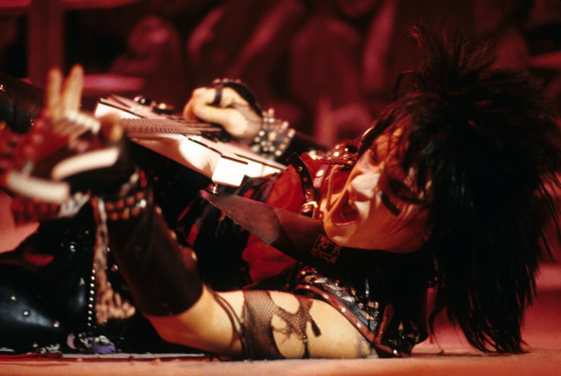 American musician Nikki Sixx, of the group Motley Crue, performs in concert, New York, New York, circa 1984. (Photo by Larry Busacca/WireImage)