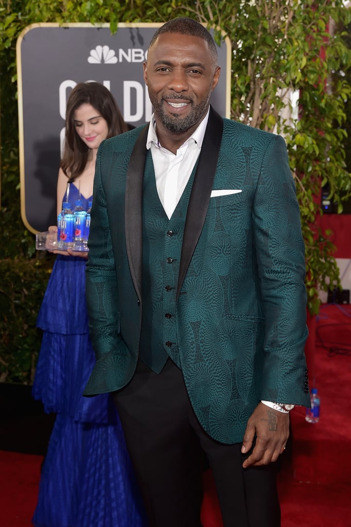 She played it coy while lurking behind Idris Elba.