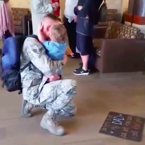 Military Dad Reunites With His Daughter Holding a Sign