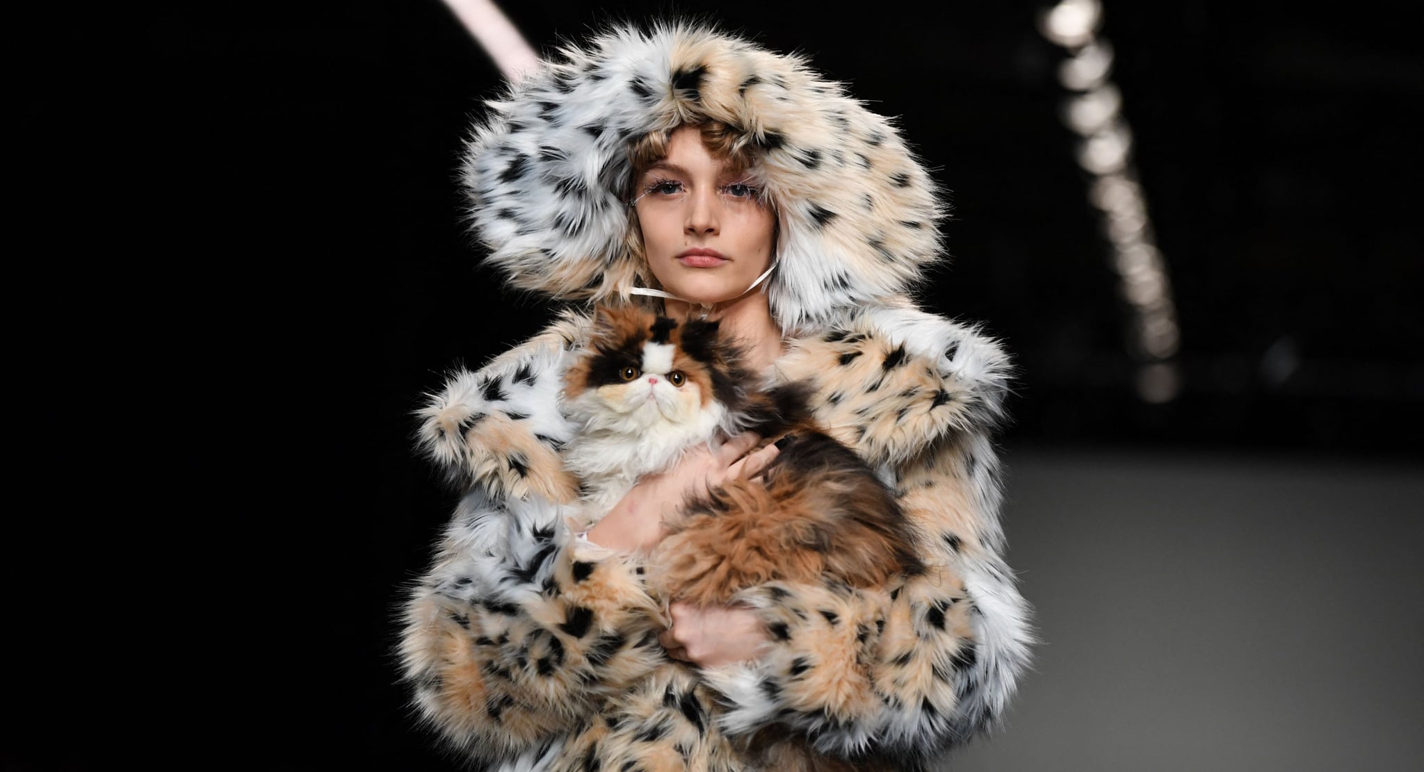 TOPSHOT - A model presents a creation by Chinese designer Yuhan Wang during the catwalk show for the Autumn/Winter 2022 collection on the third day of London Fashion Week in London on February 20, 2022. - RESTRICTED TO EDITORIAL USE (Photo by Daniel LEAL / AFP) / RESTRICTED TO EDITORIAL USE (Photo by DANIEL LEAL/AFP via Getty Images)