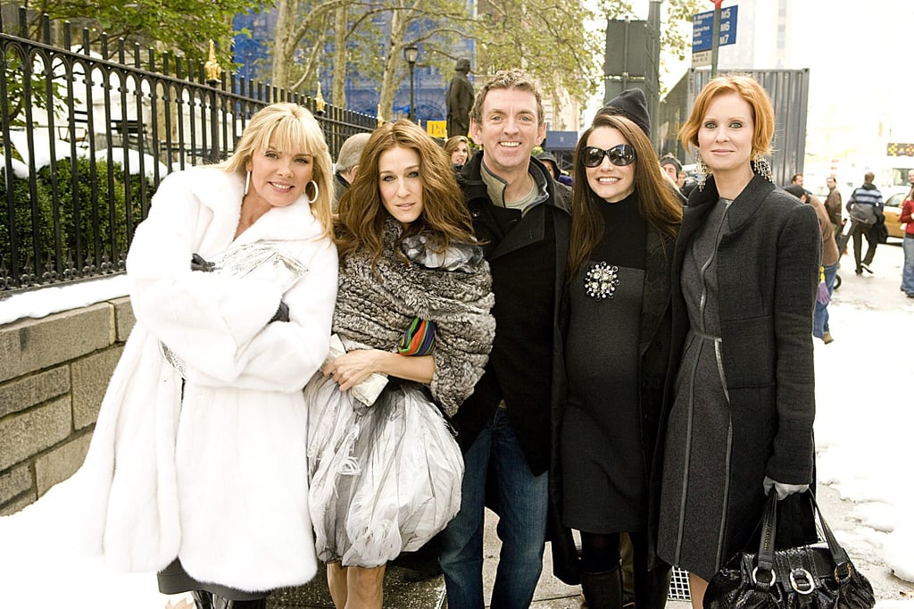 She layered herself in a plush white fur overcoat and black driving gloves for a Fashion Week appearance.