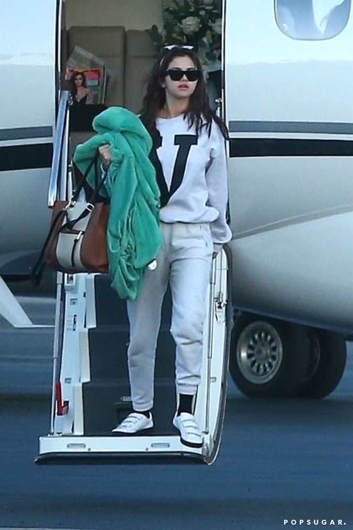 Selena Gomez Wearing Gray Sweatpants on a Plane