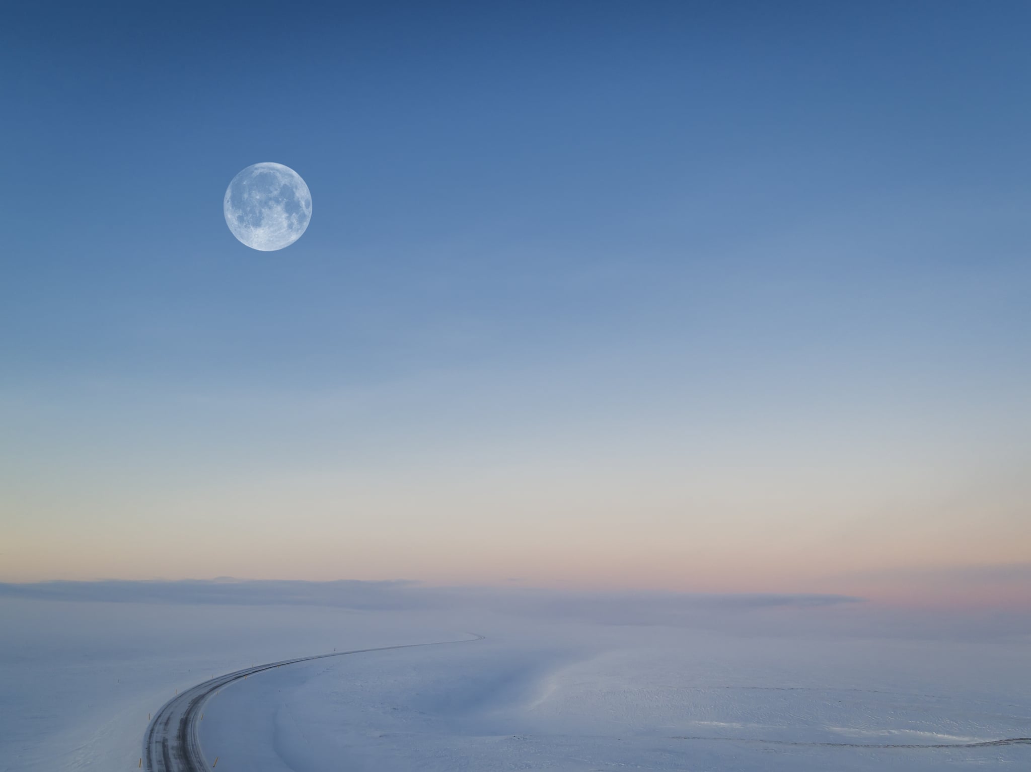 Cold Moon Over Snowy Road