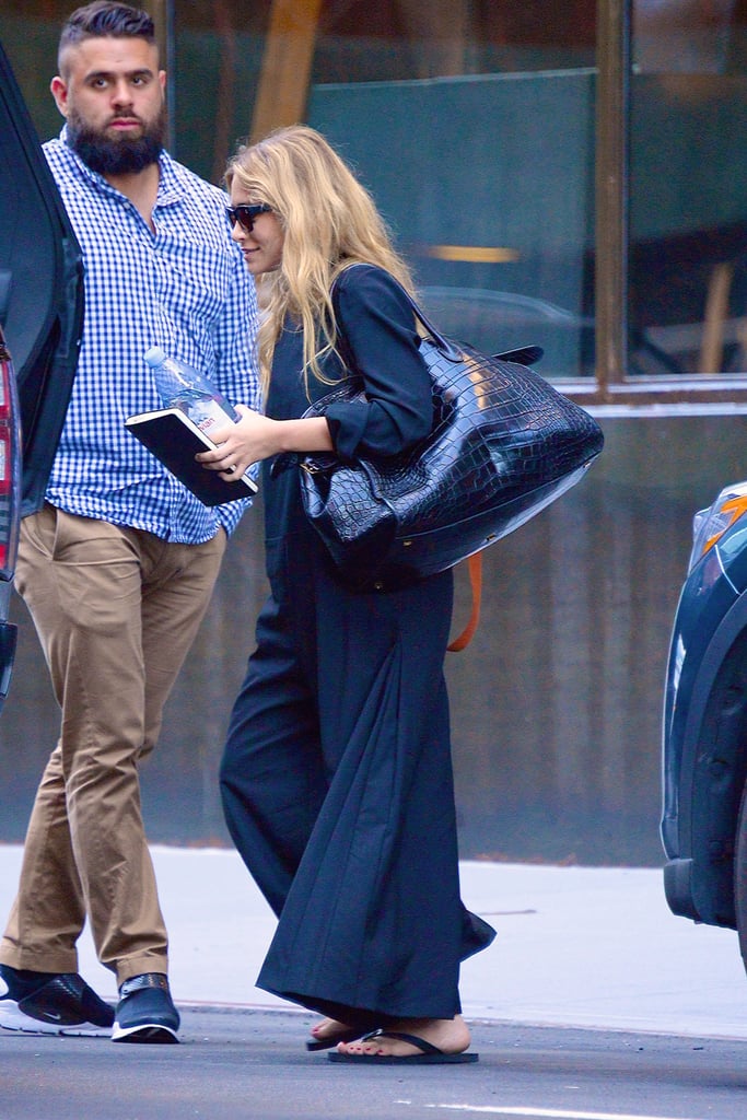 Ashley Olsen in Black Flip-Flops and Maxi Dress July 2018