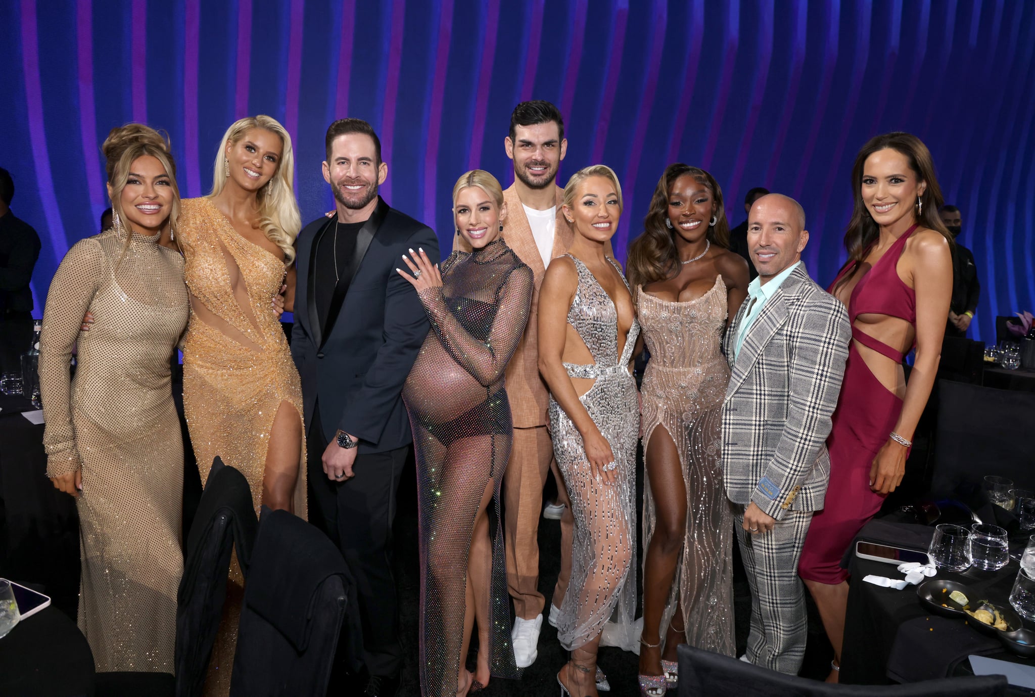 SANTA MONICA, CALIFORNIA - DECEMBER 06: 2022 PEOPLE'S CHOICE AWARDS -- Pictured: (l-r) Chrishell Stause, Emma Hernan, Tarek El Moussa, Heather Rae El Moussa, Romain Bonnet, Mary Fitzgerald, Chelsea Lazkani, Jason Oppenheim and Davina Potratz on stage during the 2022 People's Choice Awards held at the Barker Hangar on December 6, 2022 in Santa Monica, California. --  (Photo by Mark Von Holden/E! Entertainment/NBC via Getty Images)