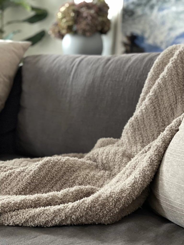 Barefoot Dreams CozyChic Throw Blanket ($124, originally $158)
This Barefoot Dreams blanket isn't just an editor favorite; it's a repeat mention from celebrities in our My Must Haves series (Khloé Kardashian and Olivia Culpo, to name just two). It's unbelievably soft and makes the perfect gift, whether you're treating yourself just because or getting a head start on holiday shopping. Read what one of our contributing shopping editors had to say about it in our Barefoot Dreams CozyChic Throw Blanket review.
Editor Quote: "I expected it to be soft and warm since the brand is practically synonymous with all things cozy — the product name is "CozyChic" after all. That said, reading about how good it feels really doesn't do it justice. Like silk pajamas or a cashmere sweater, it's hard to justify the cost until you feel it against your skin. As soon as I took it out of the packaging, my 4- and 7-year-old boys dove for the couch to curl up with it and didn't want to get up. At 54 by 72 inches, it's also large enough for two people to comfortably share — no tug of war necessary." — Angela Elias, contributing shopping editor