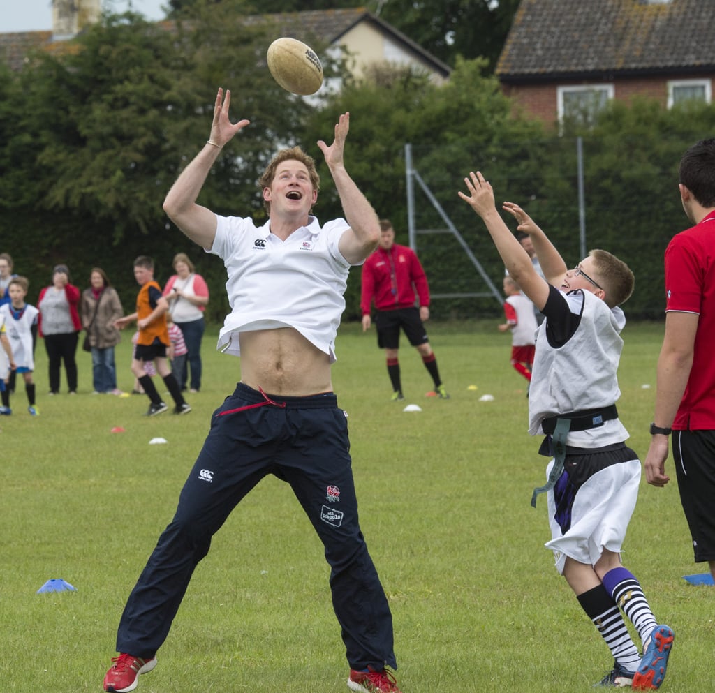 Newly single Prince Harry gave everyone a glance at his royal abs when he took part in an activity day in the Suffolk region of England.