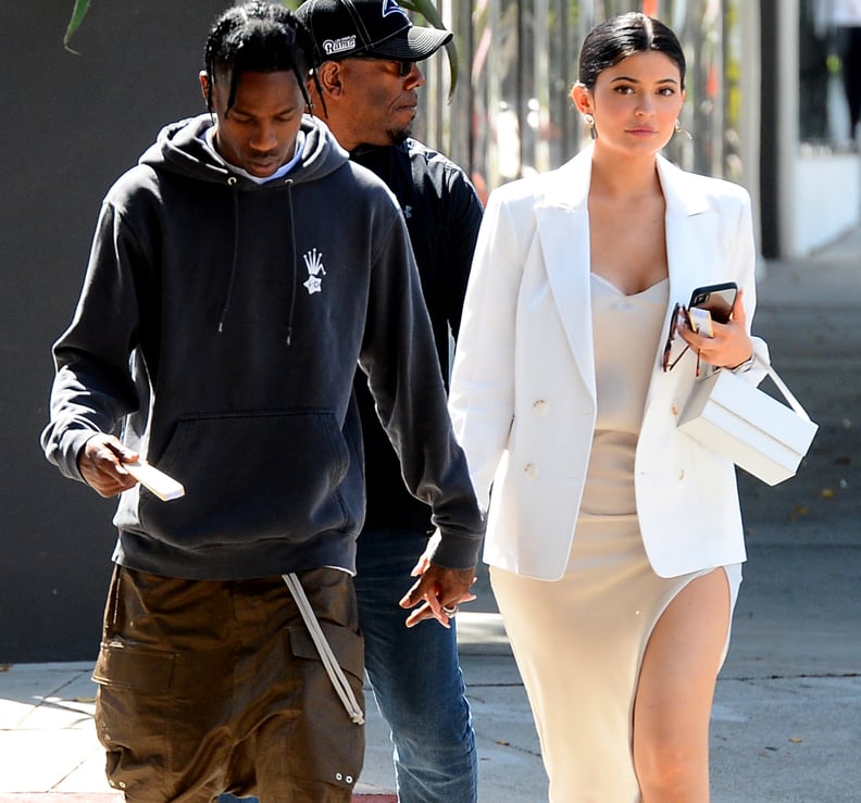 Kylie Jenner Wearing a Slitted Slip Dress and Sneakers With Travis Scott