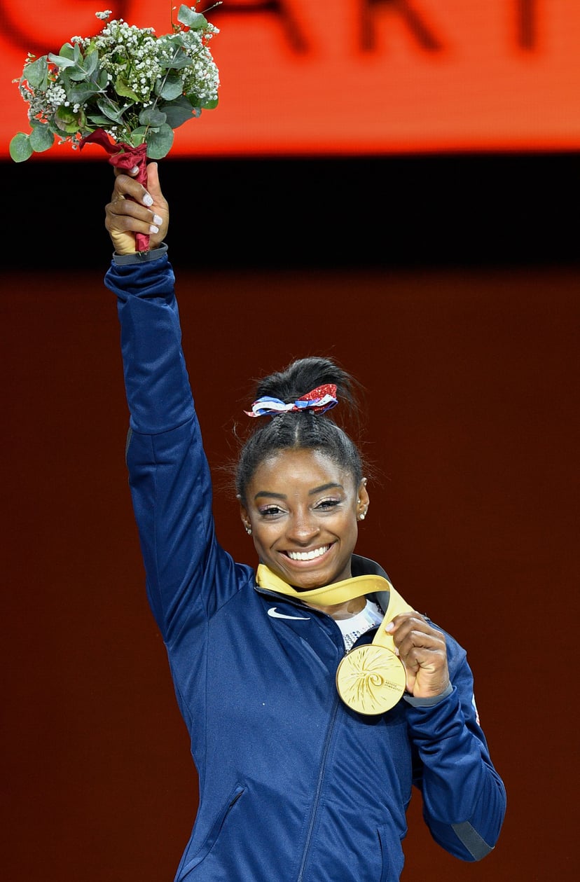 USA's Simone Biles poses on the podium during the medals ceremony of the womens all-around final at the FIG Artistic Gymnastics World Championships at the Hanns-Martin-Schleyer-Halle in Stuttgart, southern Germany, on October 10, 2019. - USA's Simone Bile