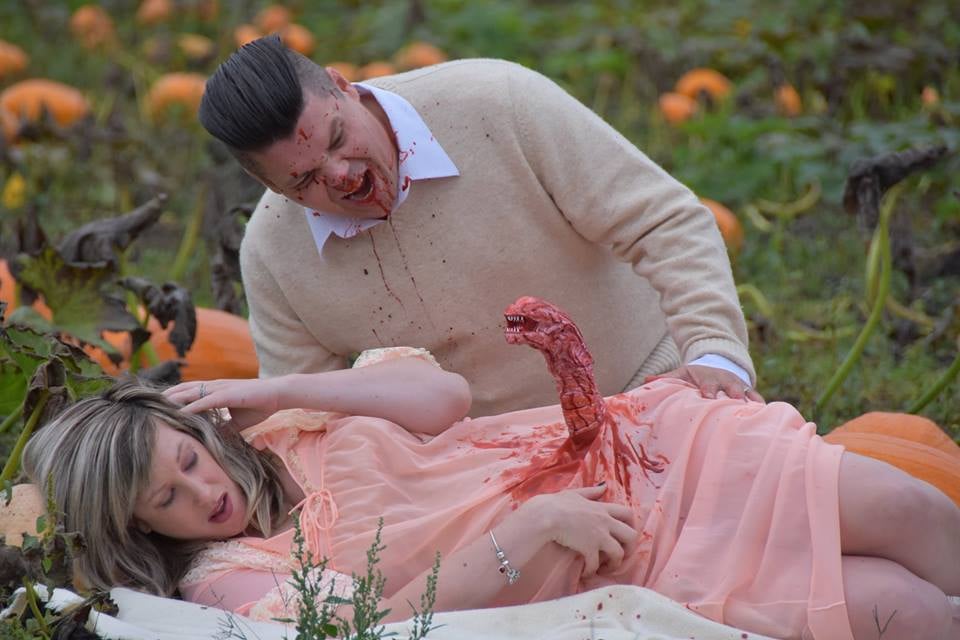 Todd and Nicole Cameron, a couple from British Columbia, Canada, wanted to make a big splash to celebrate their pregnancy. And while they don't deny that there's something sweet about doing a heartfelt maternity shoot, the pair decided to go the opposite direction with a scary movie-inspired theme, and the pictures have some serious Alien vibes. 
"I found the alien chestburster model at a garage sale this Summer," Todd told POPSUGAR. "As I was putting it together and painting it, the idea of this shoot came to me. I talked to Nicole, and she wasn't keen on a regular maternity shoot, so we decided that this would be a fun way to spread some laughs." 
"Hopefully, the baby is human!"
The soon-to-be father of two explained that he and his wife really wanted to capitalize on Nicole's mid-October due date. "If you're going to do a Fall Halloween-themed horror maternity shoot, what better place than a pumpkin patch? Luckily, there is an awesome local pumpkin patch/corn maze that was all too helpful." 
And naturally, everyone who caught a glimpse of the photos couldn't stop talking about how insanely creative they were. "Our family was over the moon excited," explained Todd, and the couple's photographer, Li Carter, immediately agreed to do the shoot upon hearing the idea. "She loved it! She has done a number of fun photo projects with us, and we make a great team," said Todd. "So she jumped at the opportunity."
Nicole and Todd wanted to be surprised with the baby's sex, however. "We have decided to wait to find out," said Todd. "Hopefully, the baby is human!"
Read through to get a peek at some of this truly terrifying maternity shoot, and try not to scream in the process. 

    Related:

            
            
                                    
                            

            12 Spirited Halloween Pregnancy Announcements Ideas For Revealing Your Little Pumpkin