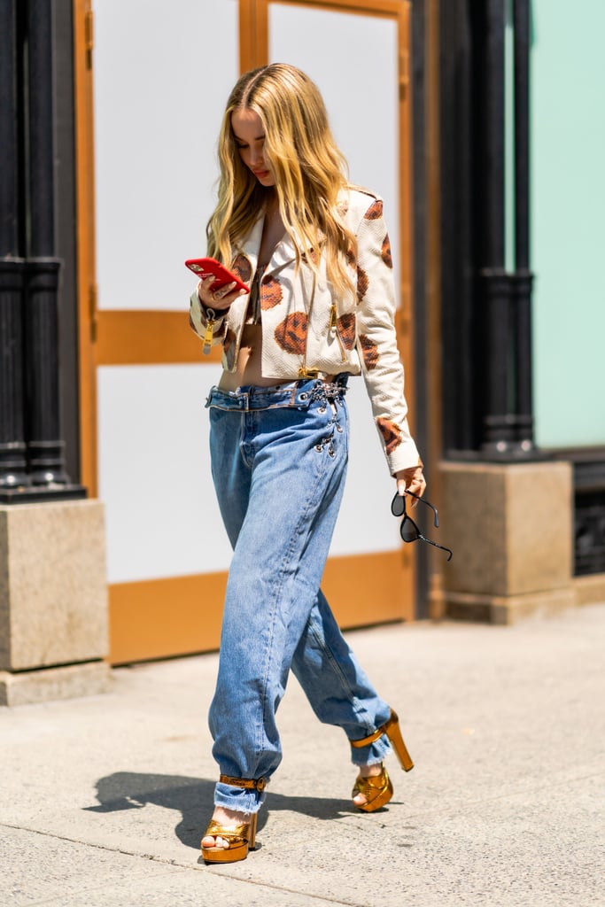 Dove Cameron Wearing Low-Rise Jeans and Moschino Top in NYC