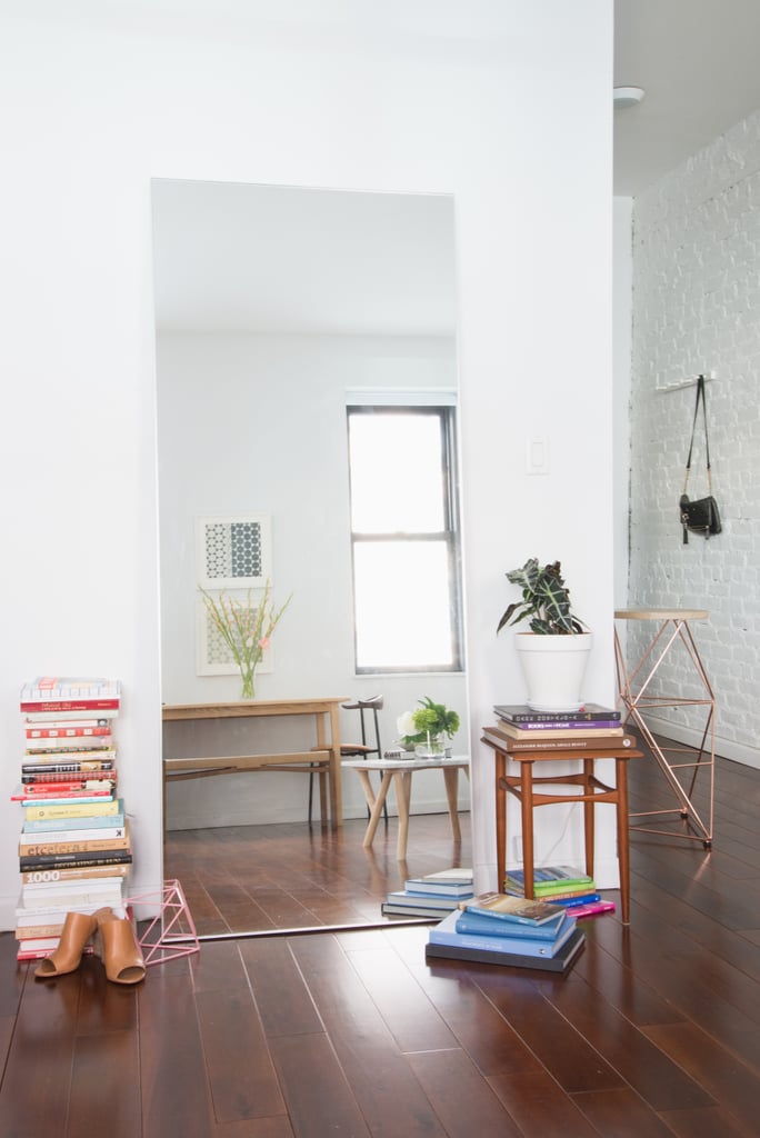 A cleverly placed mirror helps reflect light and amplify space.