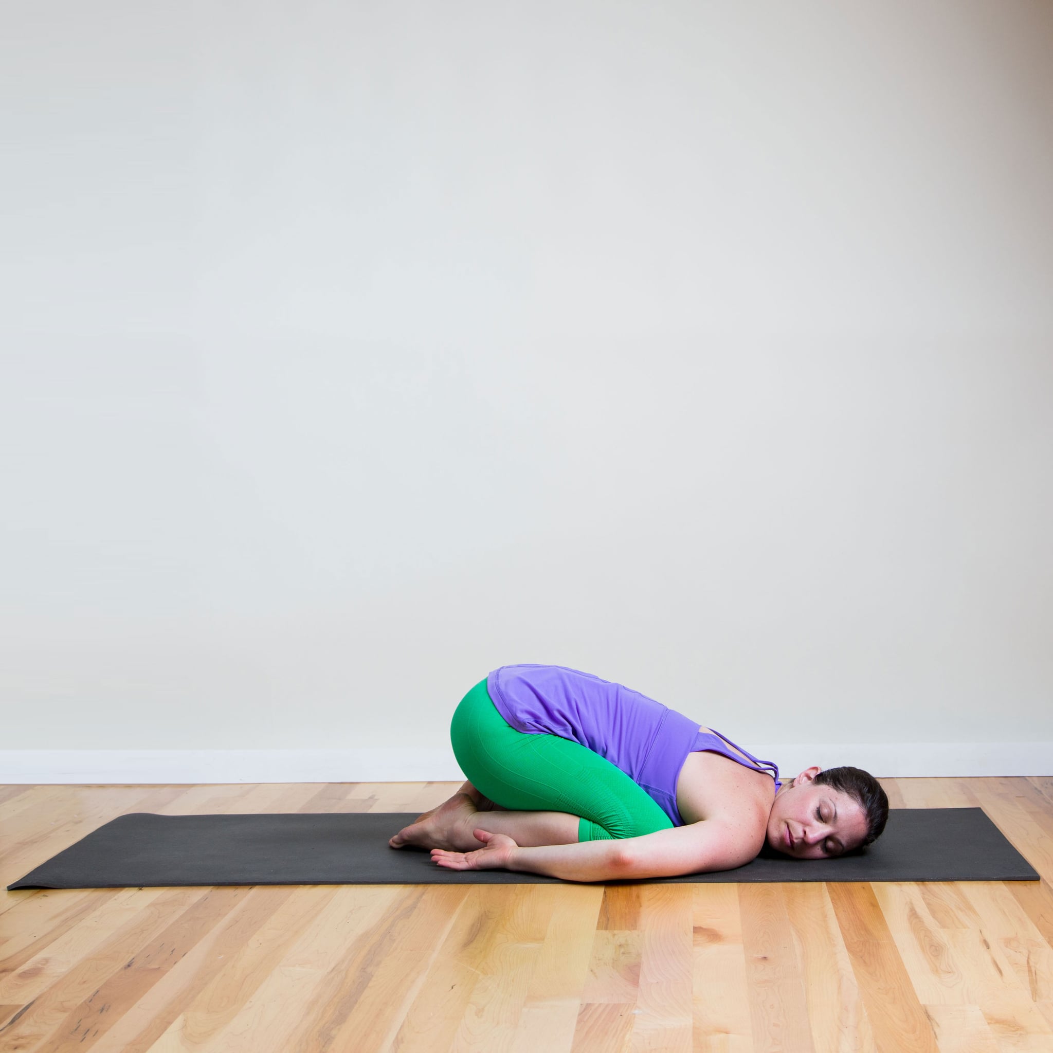 Full Body Shot Of An Adult Woman In A Workout Outfit As She Does A Yoga Pose  High-Res Stock Photo - Getty Images
