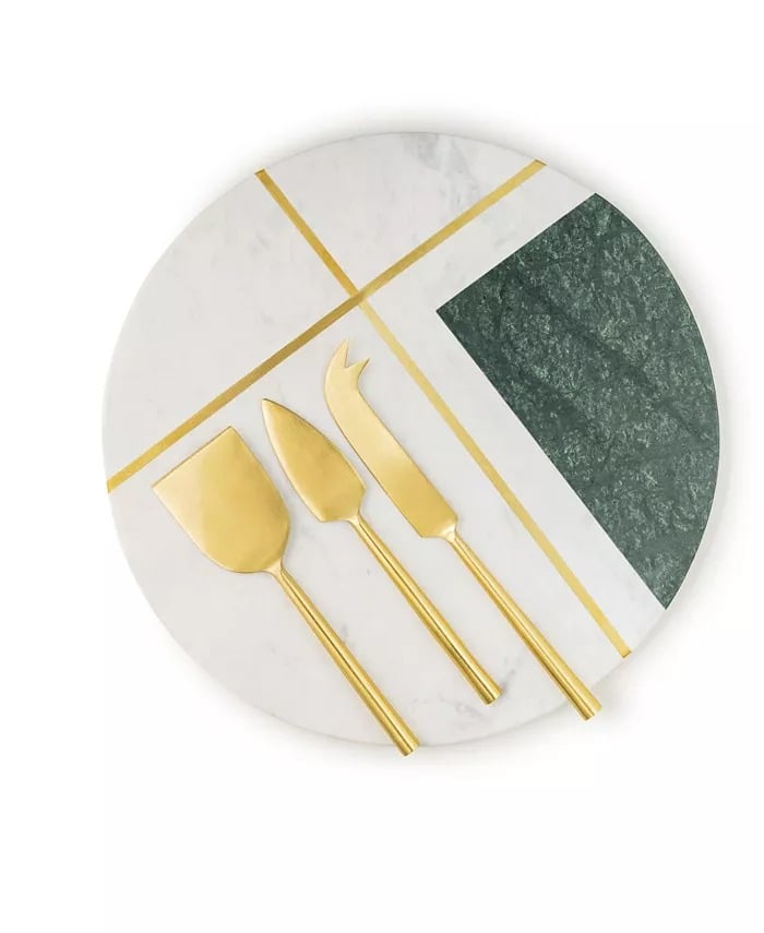 GAURI KOHLI Vista Marble Cheese Board With Knives ($70)
Add a little luxury to their girl dinner with this sophisticated handmade marble cheese board. It's got plenty of space for their brie, crackers, and dried fruit, and comes with three golden cheese knives in case they want to share. Let's hope they do.