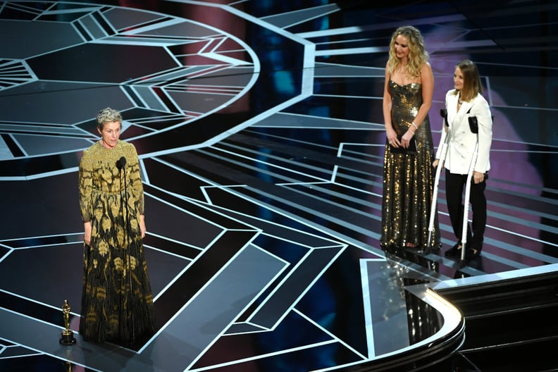 HOLLYWOOD, CA - MARCH 04:  Actor Frances McDormand (L) accepts Best Actress for 'Three Billboards Outside Ebbing, Missouri' from actors Jennifer Lawrence and Jodie Foster onstage during the 90th Annual Academy Awards at the Dolby Theatre at Hollywood & Hi