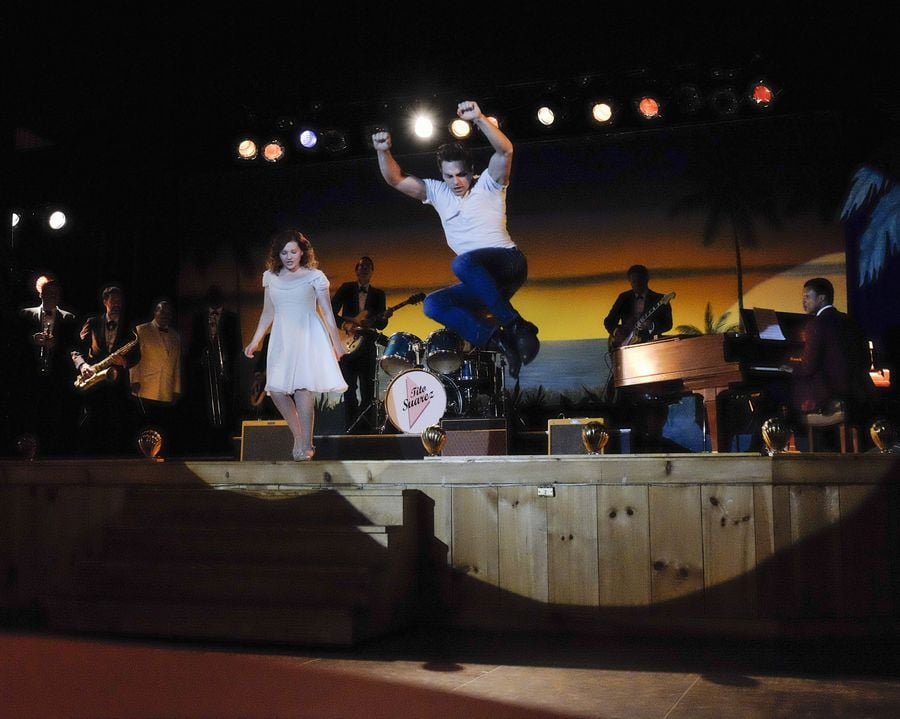 Here she is judging whether she can jump off the stage or not.