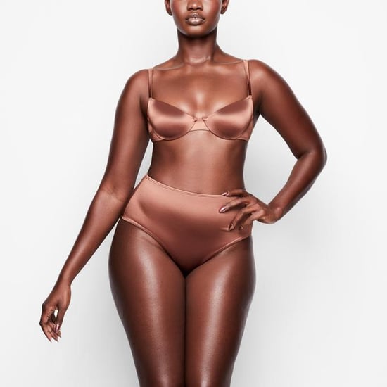 SKIMS Stretch Satin Smoothing Bodysuit in Desert Clay, SKIMS Is Launching  a Sexy Stretch Satin Lingerie Line Just in Time For Valentine's Day