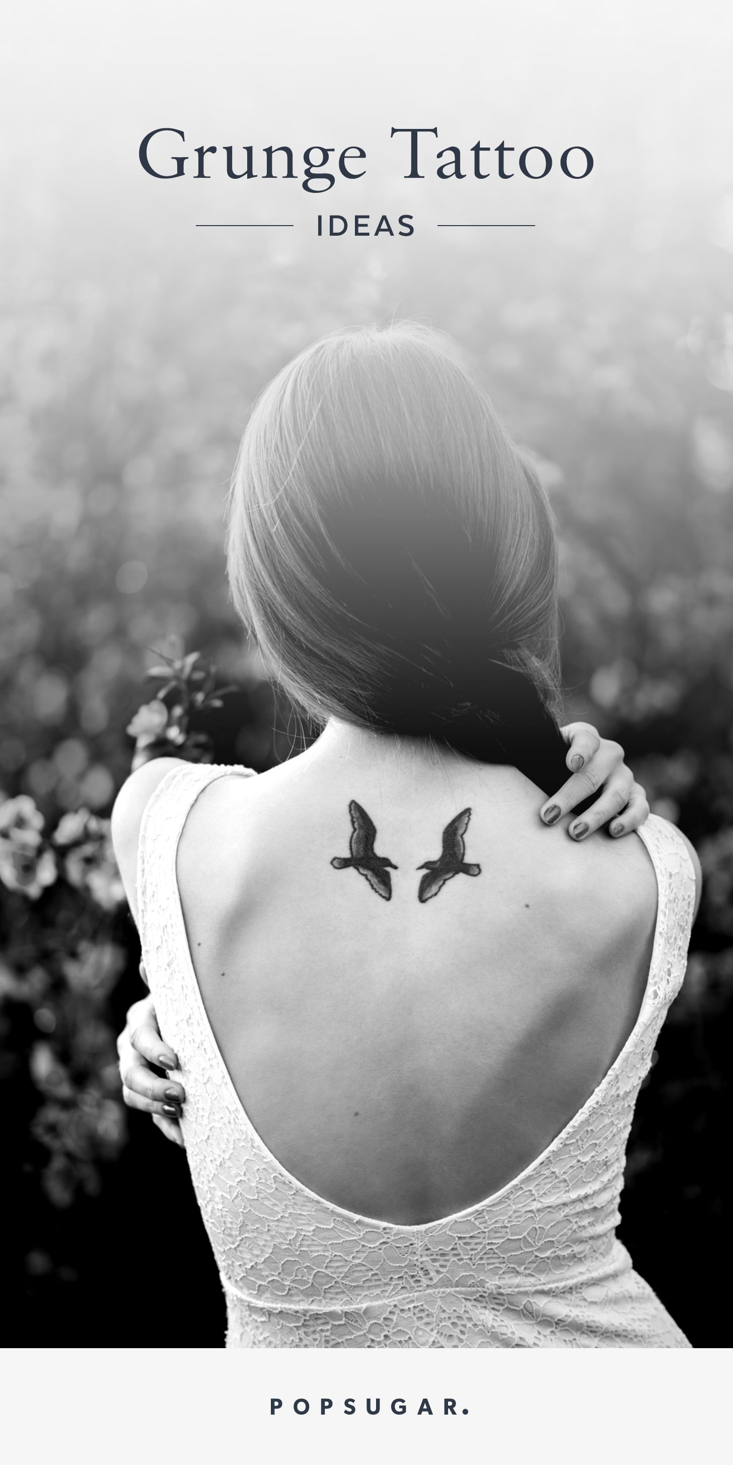 Beautiful young woman with a detailed tattoo on her back and arms. That  reads Nirvana. 