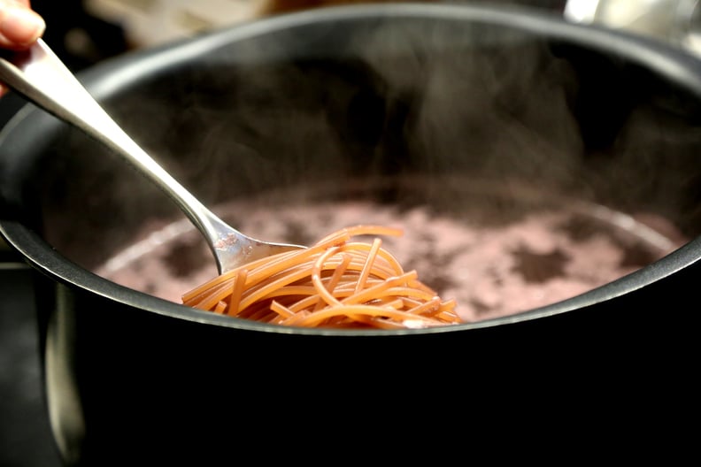 Boil spaghetti in red wine.