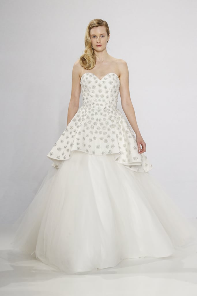 Embroidered strapless overlay gown.