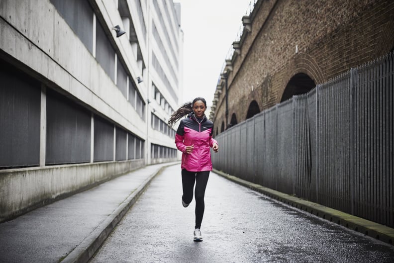 Female runner in city.