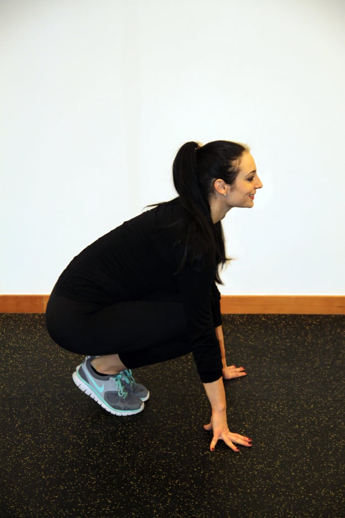 B. Squat down and place both hands on the floor.