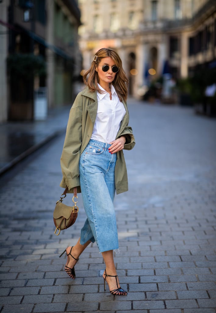 Elevate cropped wide-leg jeans with a utility-inspired anorak, crisp shirt, and heels.