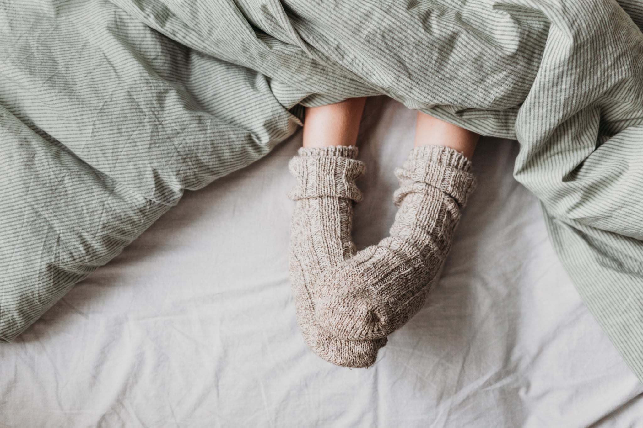 Person wearing socks to bed.