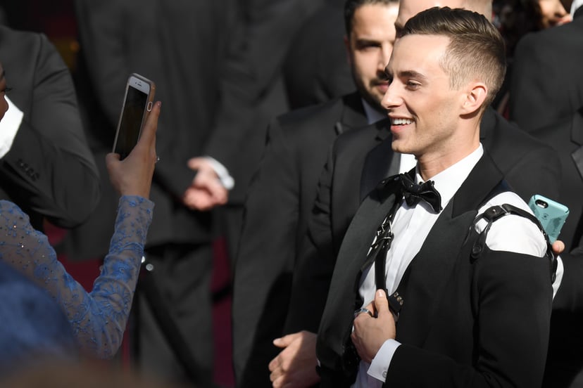US Olympic medalist Adam Rippon (R) arrives for the 90th Annual Academy Awards on March 4, 2018, in Hollywood, California.  / AFP PHOTO / Robyn Beck        (Photo credit should read ROBYN BECK/AFP/Getty Images)