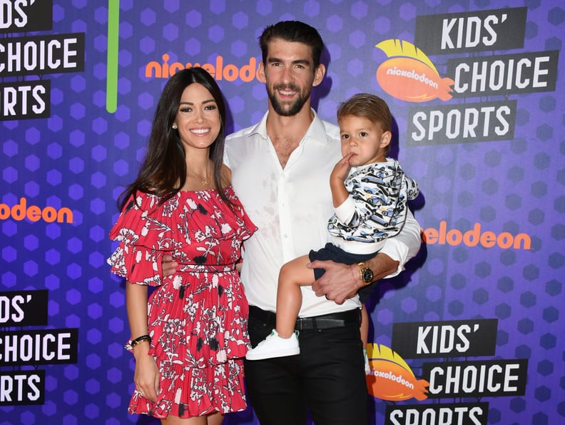 SANTA MONICA, CA - JULY 19:  (L-R) Nicole Johnson, swimmer Michael Phelps, and Boomer Robert Phelps attend the Nickelodeon Kids' Choice Sports 2018 at Barker Hangar on July 19, 2018 in Santa Monica, California.  (Photo by Jon Kopaloff/Getty Images)