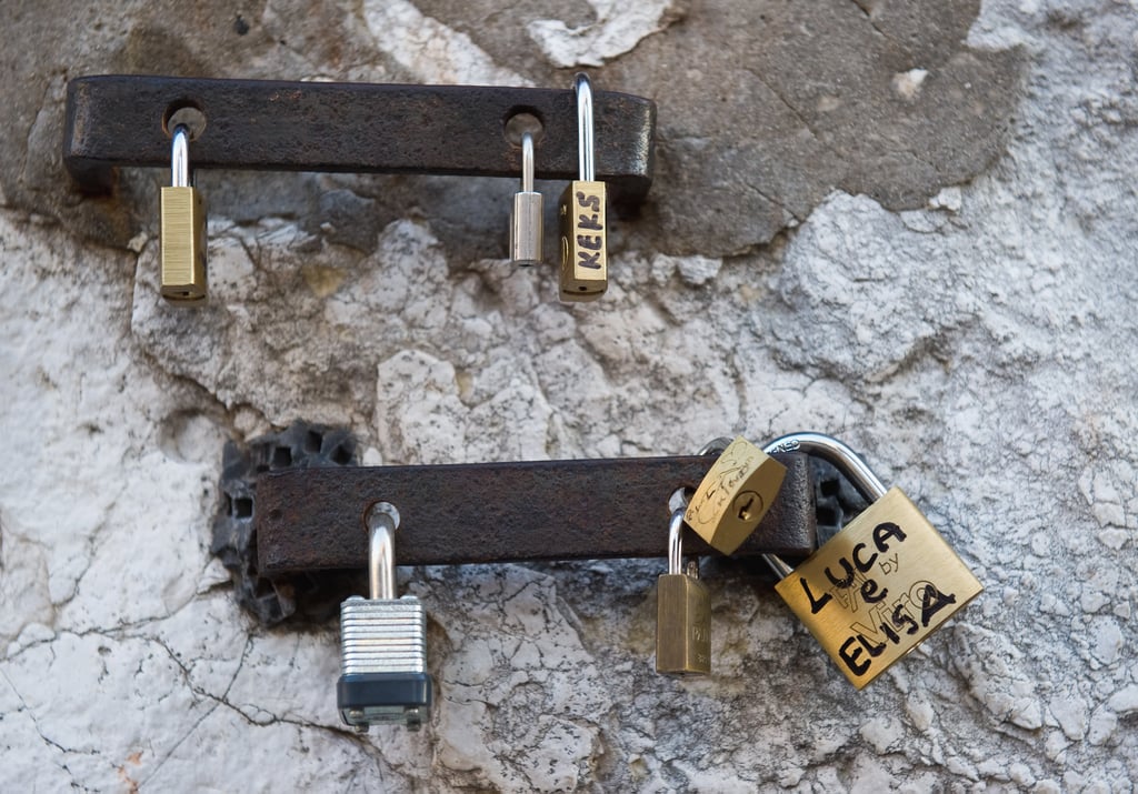 Love locks were attached to a wall on Rialto Bridge in Venice, Italy. Pictures of Love