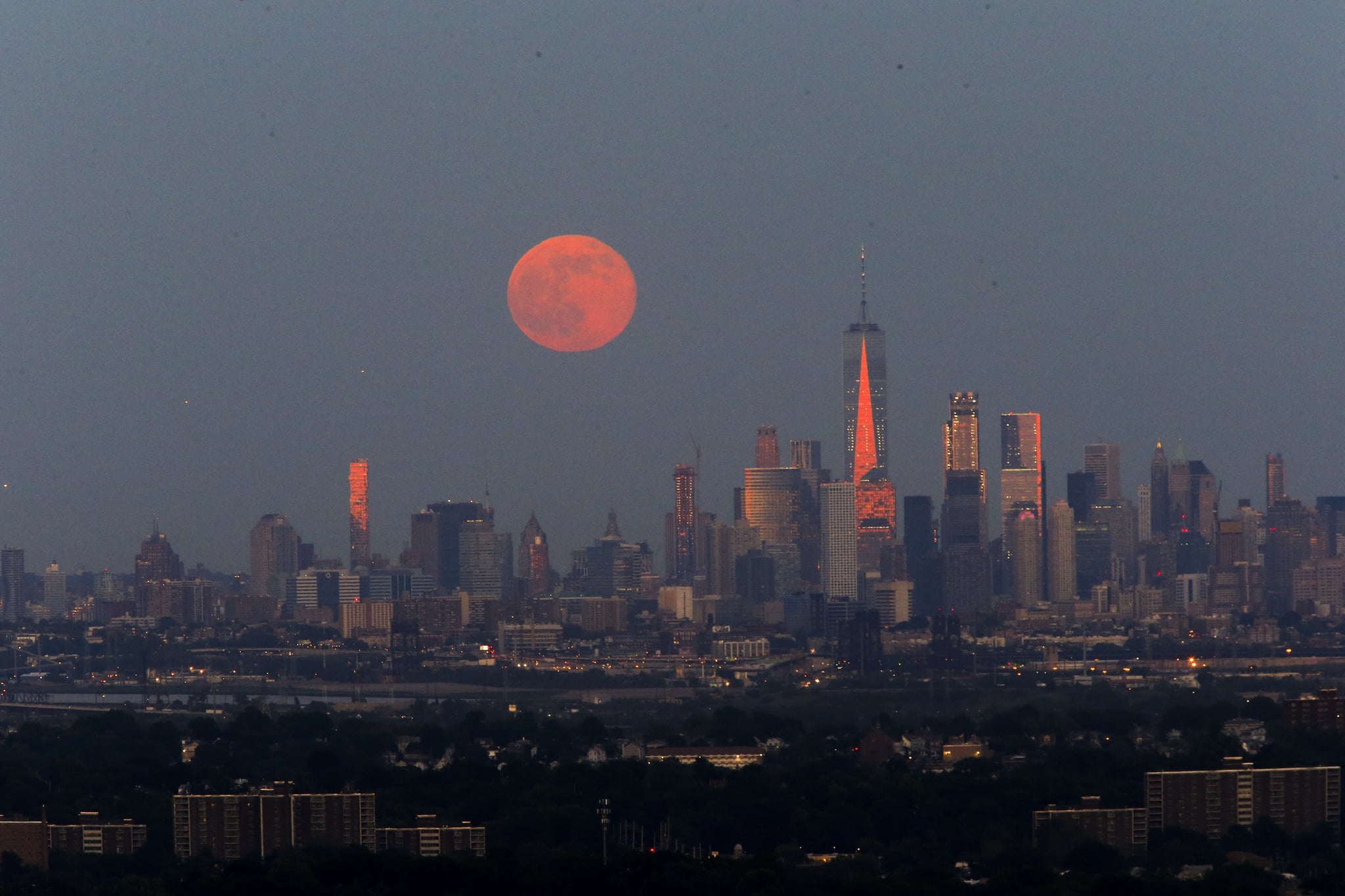 EAGLE ROCK, NJ - JUNE 09: The Strawberry Moon rises over lower Manhattan next to One World Trade Centre on June 06, 2017 in Montclair, New Jersey. (Photo by Eduardo Munoz Alvarez/VIEWpress/Corbis via Getty Images)