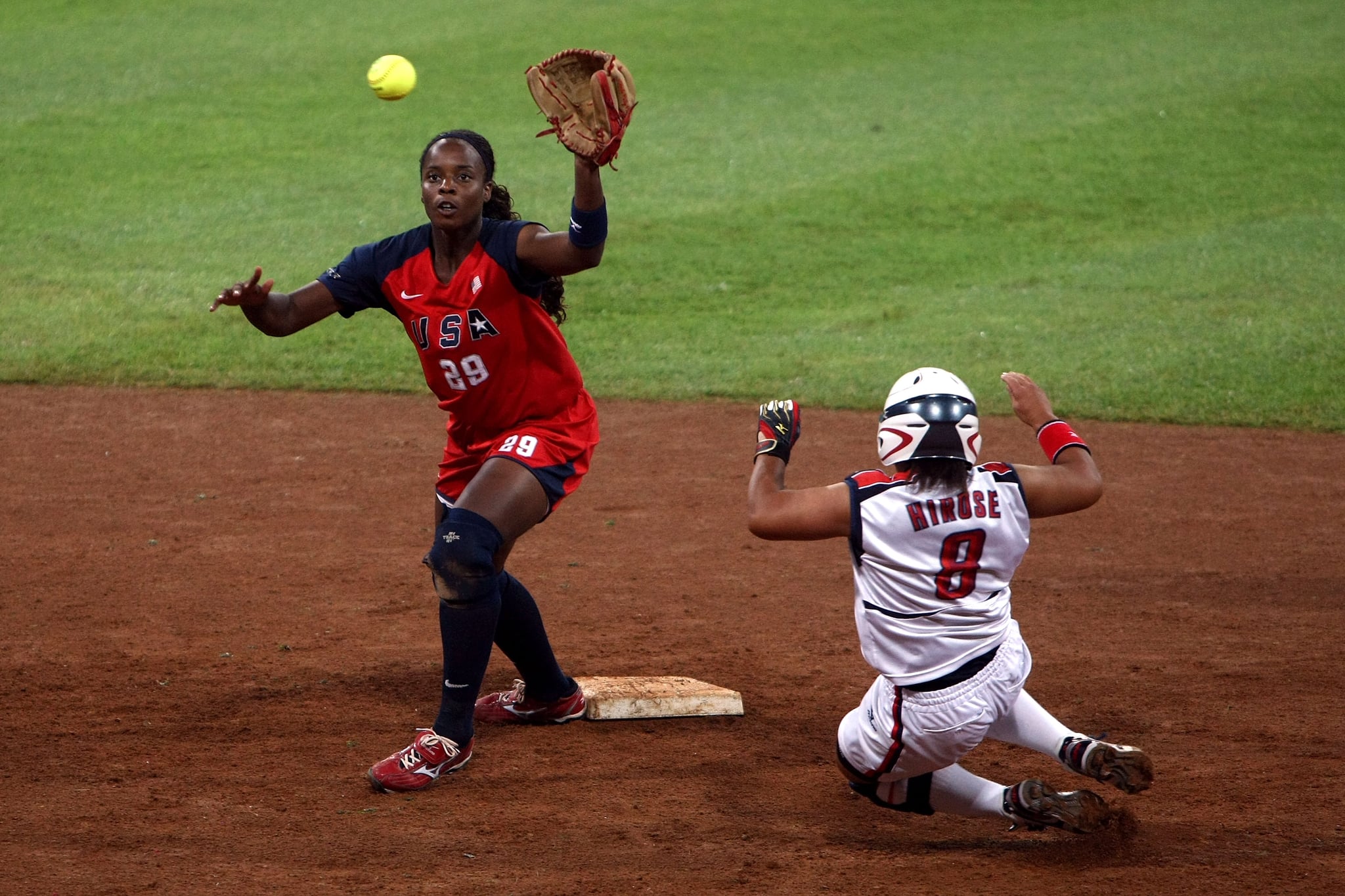 BEIJING - AUGUST 21: Megu Hirose #8 of Japan slides into second base as shortstop Natasha Watley #28 of the United States waits for the ball during the women's grand final gold medal softball game at the Fengtai Softball Field during Day 13 of the Beijing 2008 Olympic Games on August 21, 2008 in Beijing, China. (Photo by Jonathan Ferrey/Getty Images)