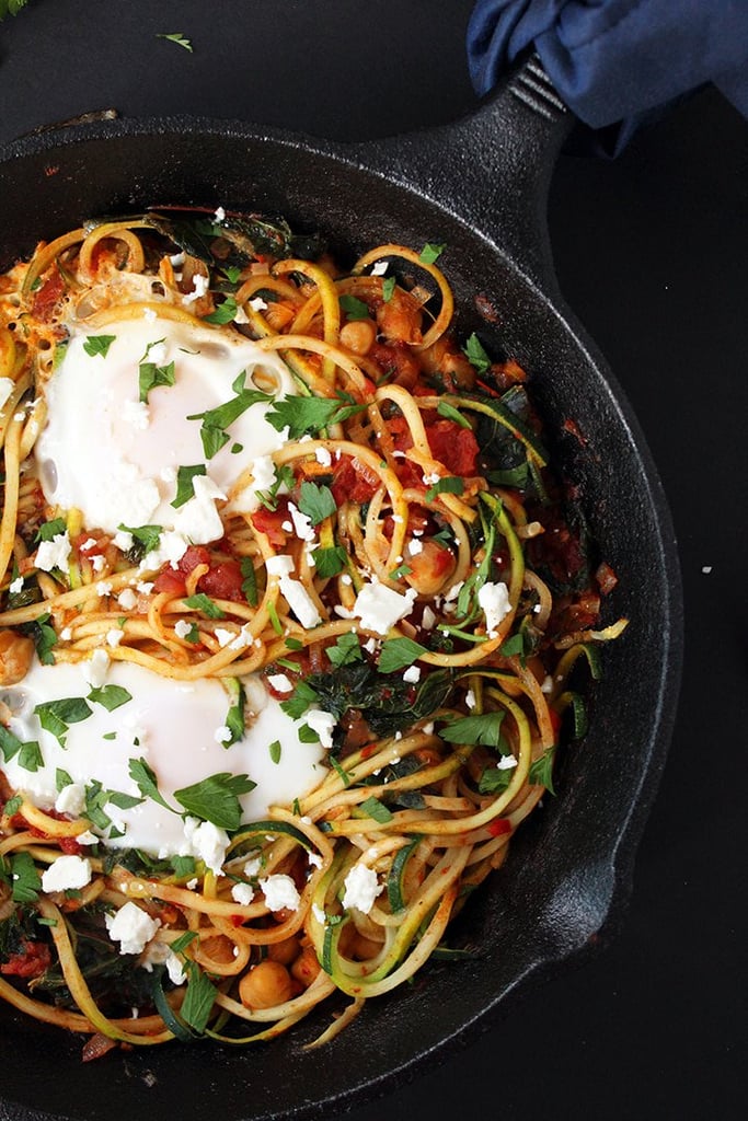 Harissa Zucchini Spaghetti Skillet With Kale, Chickpeas, and Poached Eggs