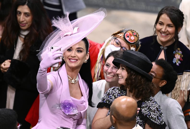 LONDON, ENGLAND - MAY 06: Katy Perry takes selfies with guests during the Coronation of King Charles III and Queen Camilla on May 06, 2023 in London, England. The Coronation of Charles III and his wife, Camilla, as King and Queen of the United Kingdom of 