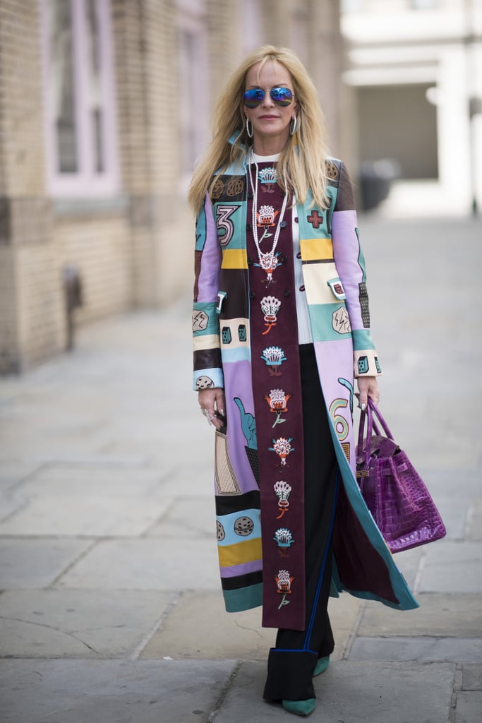 If you don't want to wear a full-on purple look, mix it in with other colors. This street style star pulls it off perfectly with her Valentino trench coat.