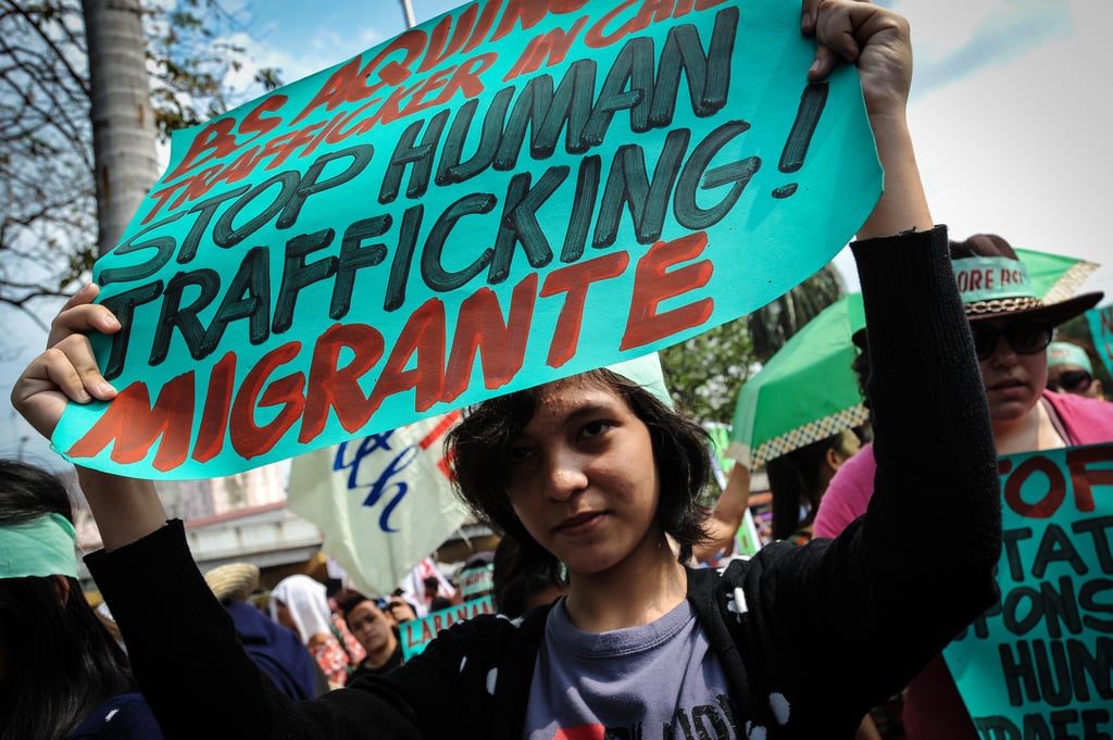 An activist in the Philippines held up a sign during a rally for International Women's Day.