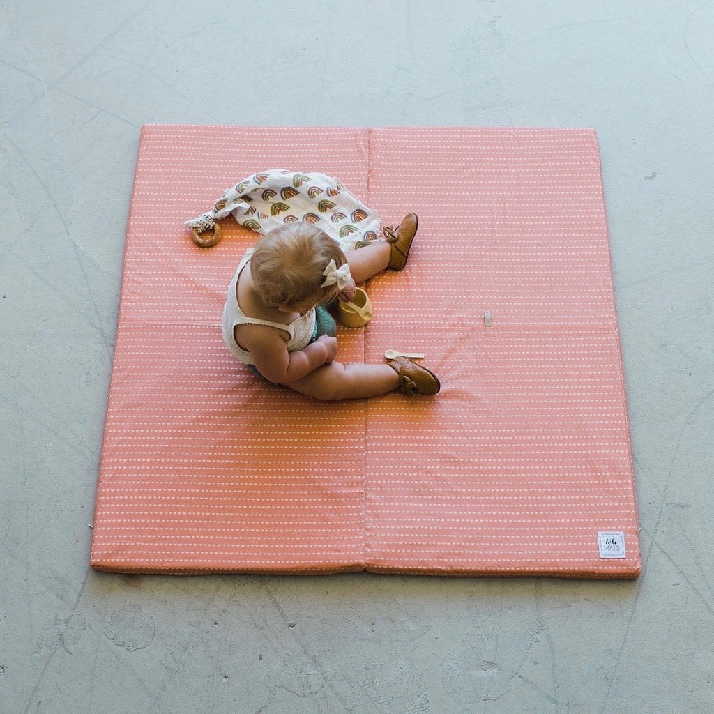 Coral crescent padded play mat