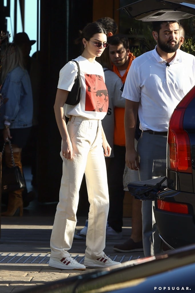 Kendall wore a pair of Martine Rose straight leg jeans with her Adidas Forum sneakers while out in LA. Up top, she opted for a Calvin Klein Andy Warhol tee and a Prada purse.