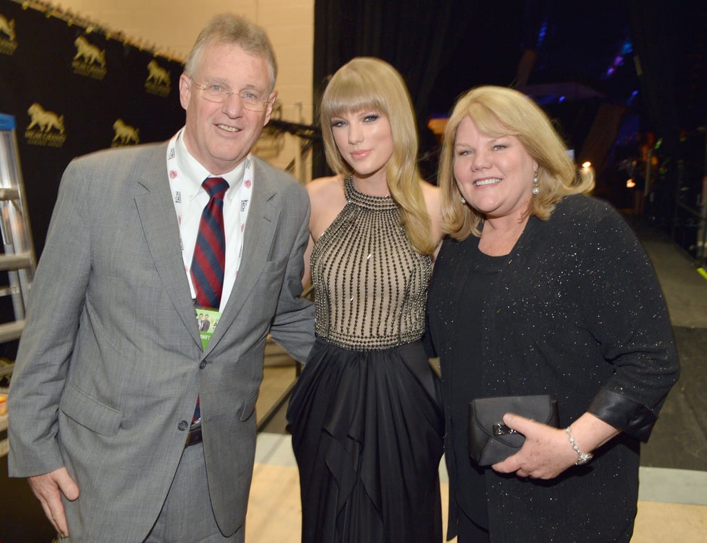 During the Academy of Country Music Awards in April 2013, Taylor posed with her mom Andrea and dad Scott backstage.