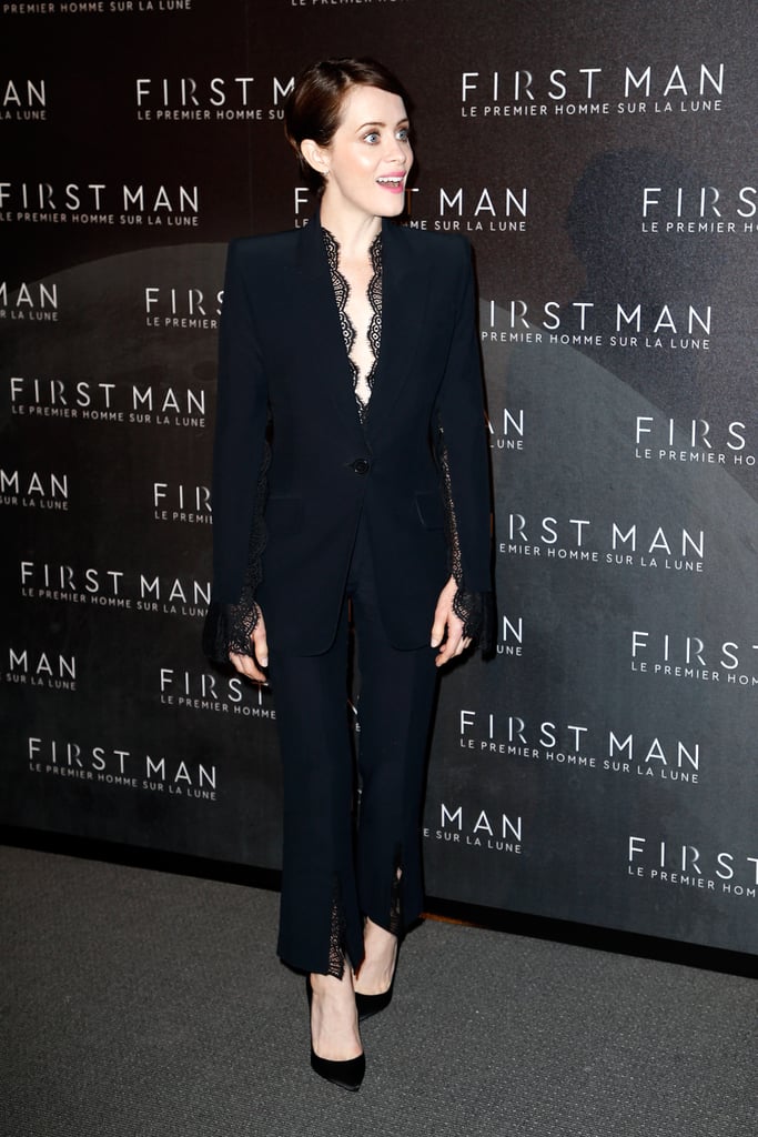 When in France, Claire looked incredibly chic in a black trouser suit that featured delicate lace detailing.