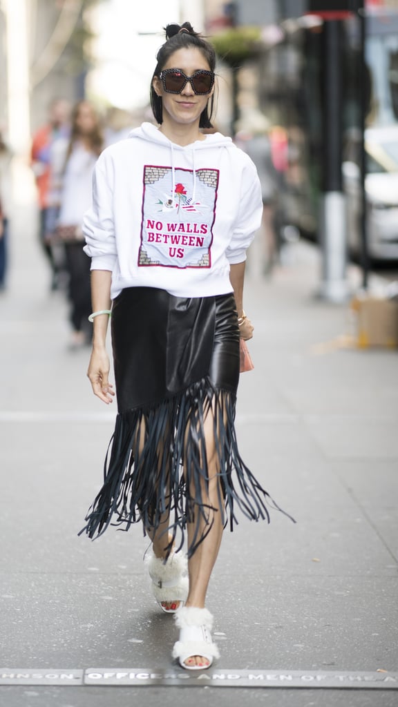 With a Fringed Skirt and Graphic Sweatshirt