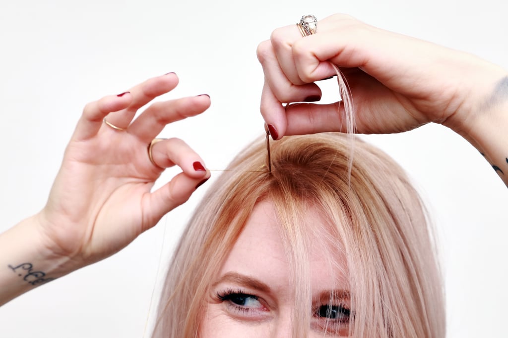 To attach the tinsel, take one strand of it and bring both ends Half