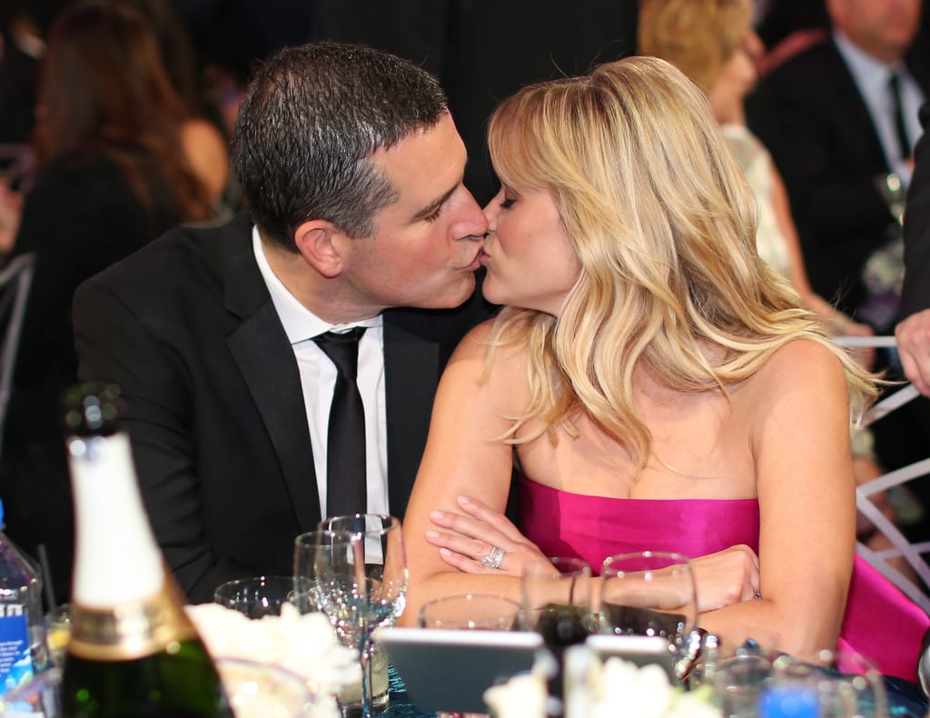 Reese Witherspoon and her husband, Jim Toth, shared a kiss at their table.