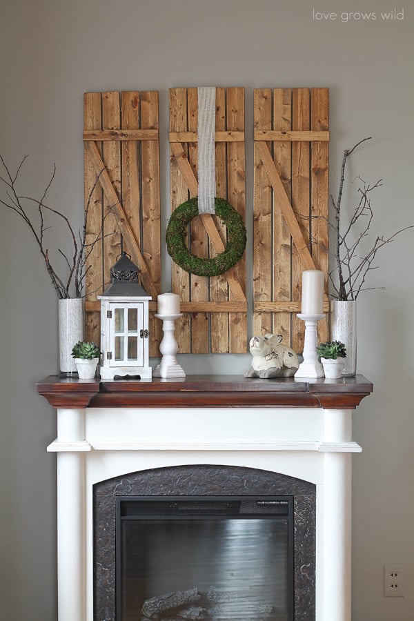 For a sophisticated Spring palette, skip the pastels and go for white, green, and brown decor set atop a rustic wood backdrop.