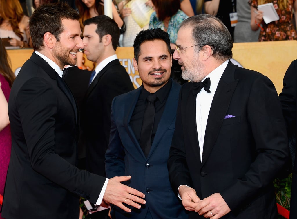 Bradley Cooper stopped to say hi to Michael Peña and Mandy Patinkin.